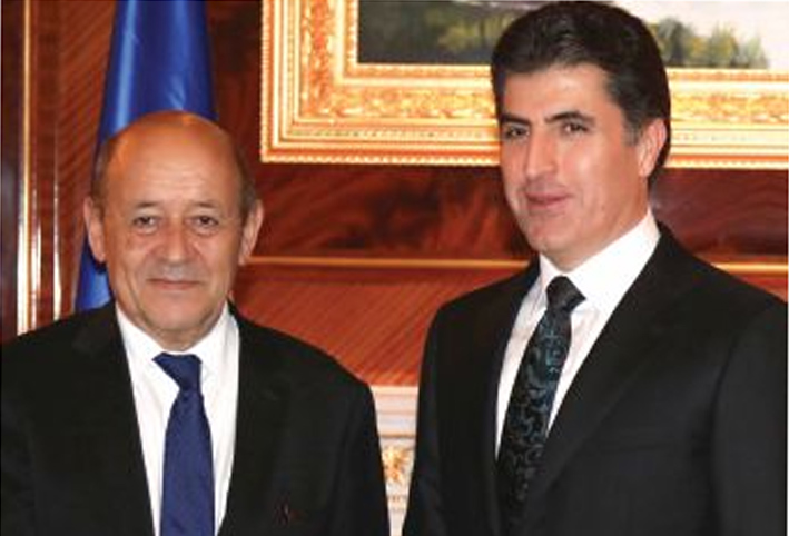 نيجيرفان بارزاني مستقبلاً لودريان في أربيل (أ ف ب)